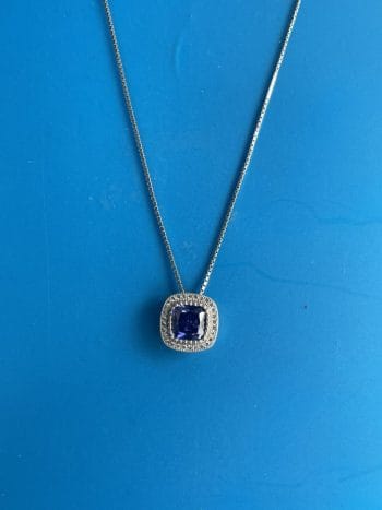 sterling silver necklace set with blue and clear cublic zirconias on 18